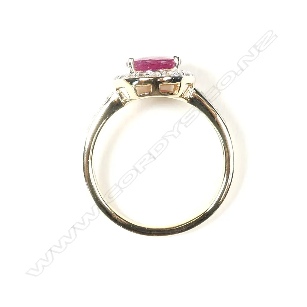 A 14ct gold ruby and diamond halo ring Image 1++