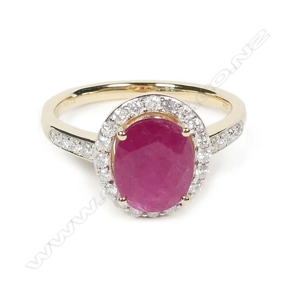 A 14ct gold ruby and diamond halo ring Image 1++