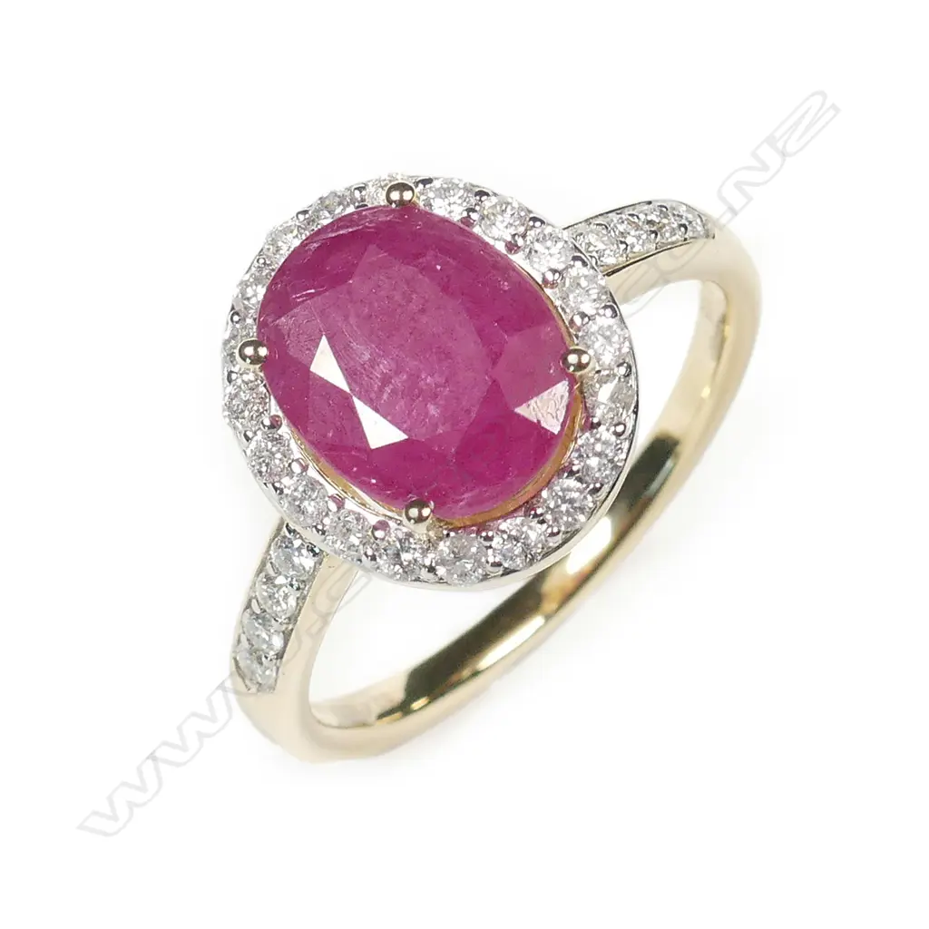 A 14ct gold ruby and diamond halo ring Image 1++