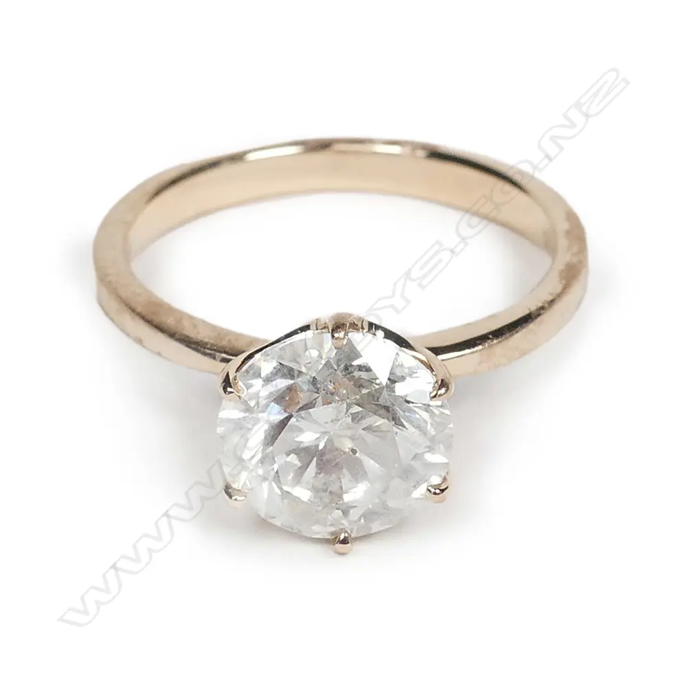 A 14ct rose gold diamond solitaire ring Image 1++