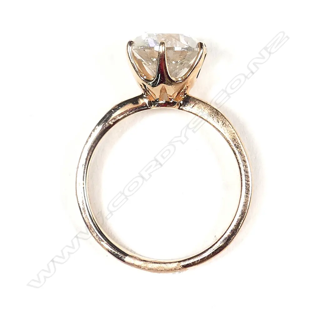A 14ct rose gold diamond solitaire ring Image 1++