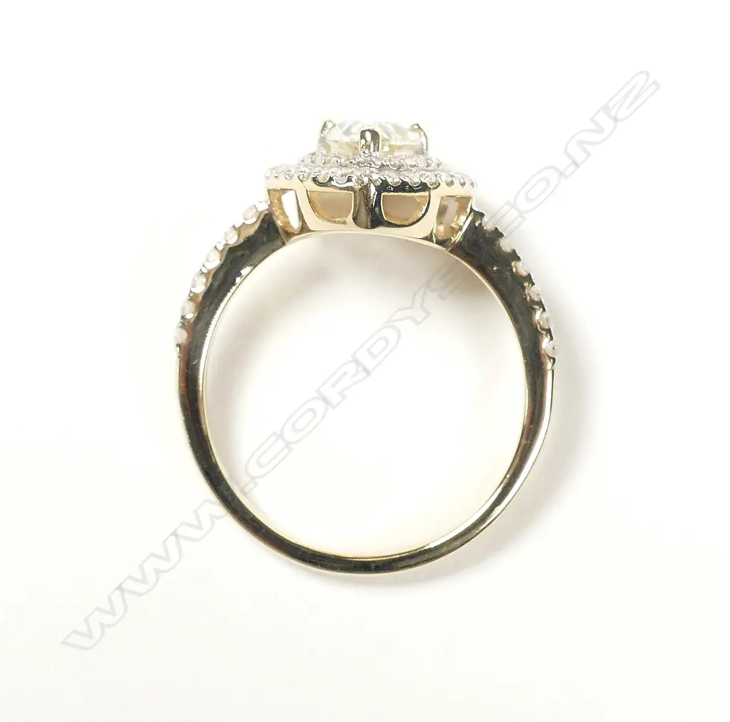 A 14ct gold double halo diamond ring Image 1++