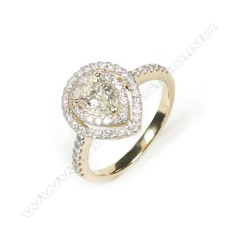 A 14ct gold double halo diamond ring Image 1++