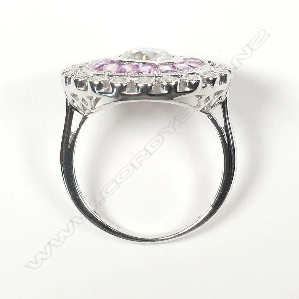 An 18ct white gold diamond and sapphire ring Image 1++