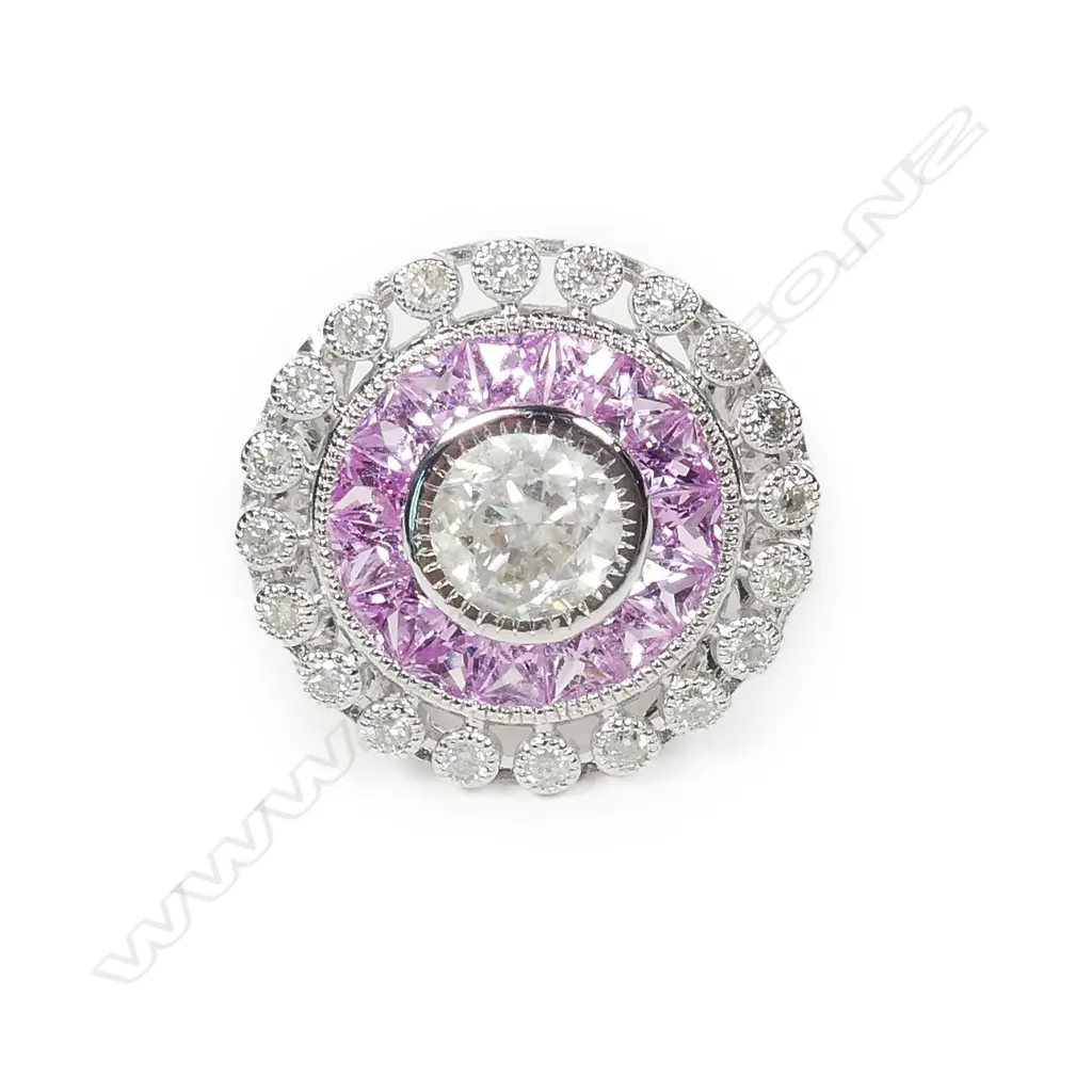 An 18ct white gold diamond and sapphire ring Image 1++