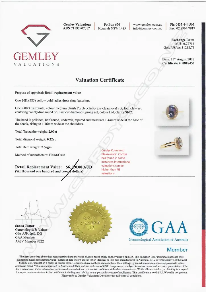 A 14ct gold tanzanite and diamond halo ring Image 1++