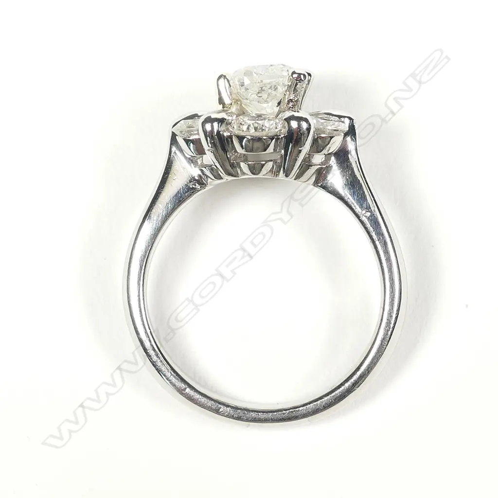 A platinum and diamond ring Image 1++
