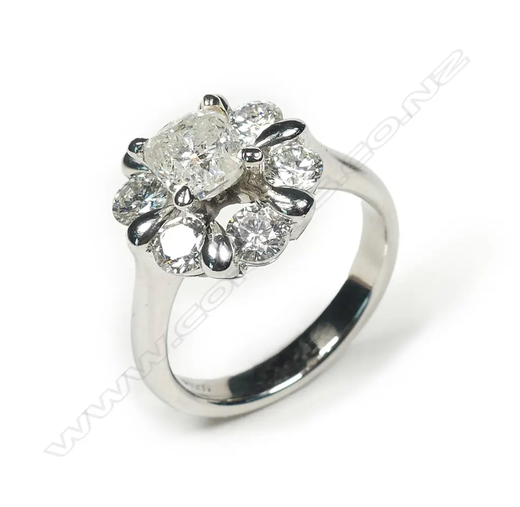 A platinum and diamond ring Image 1++