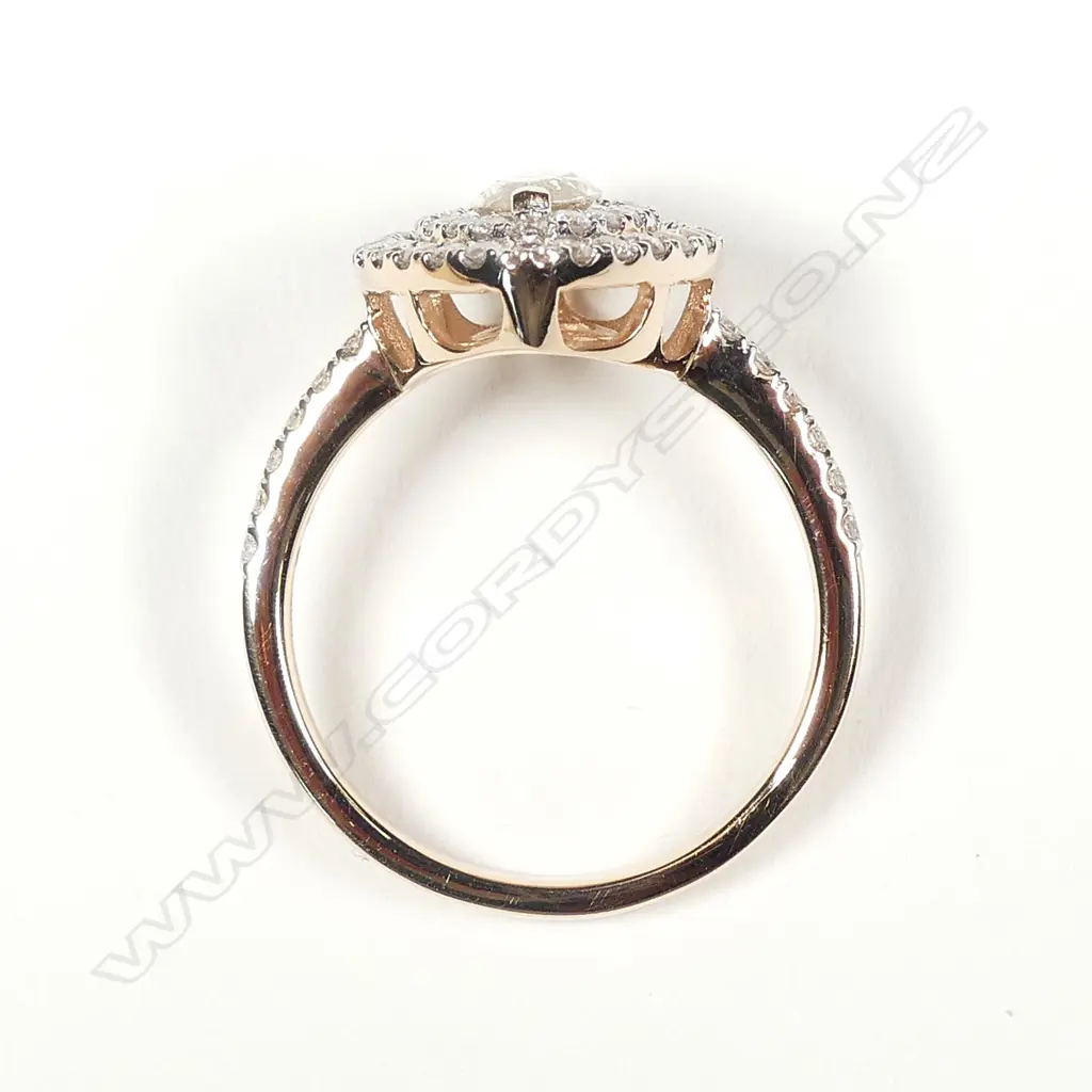 A 14ct rose gold and diamond double halo ring Image 1++