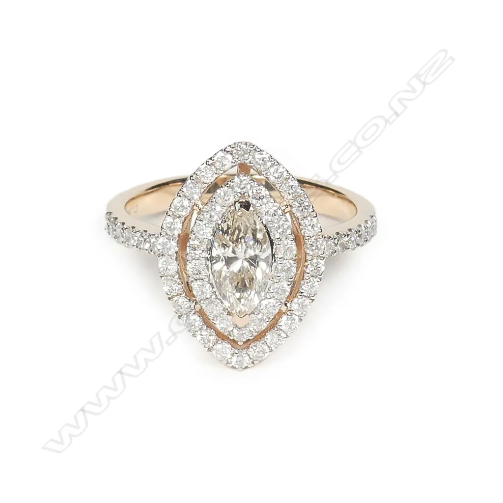 A 14ct rose gold and diamond double halo ring Image 1++