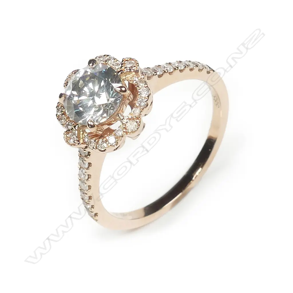 A 14ct rose gold and diamond halo ring Image 1++