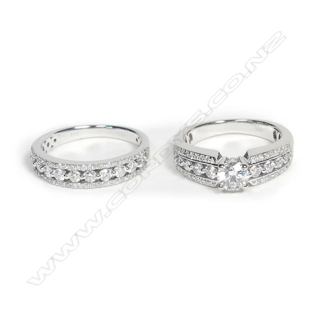 A pair of modern 18ct. white gold and diamond engagement and wedding rings Image 1++