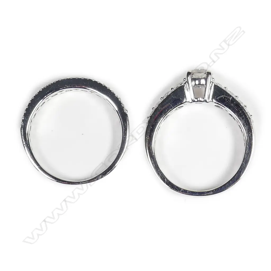 A pair of modern 18ct. white gold and diamond engagement and wedding rings Image 1++