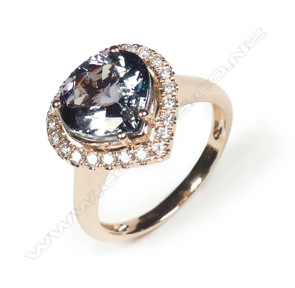 A 14ct rose gold tanzanite and diamond ring Image 1++