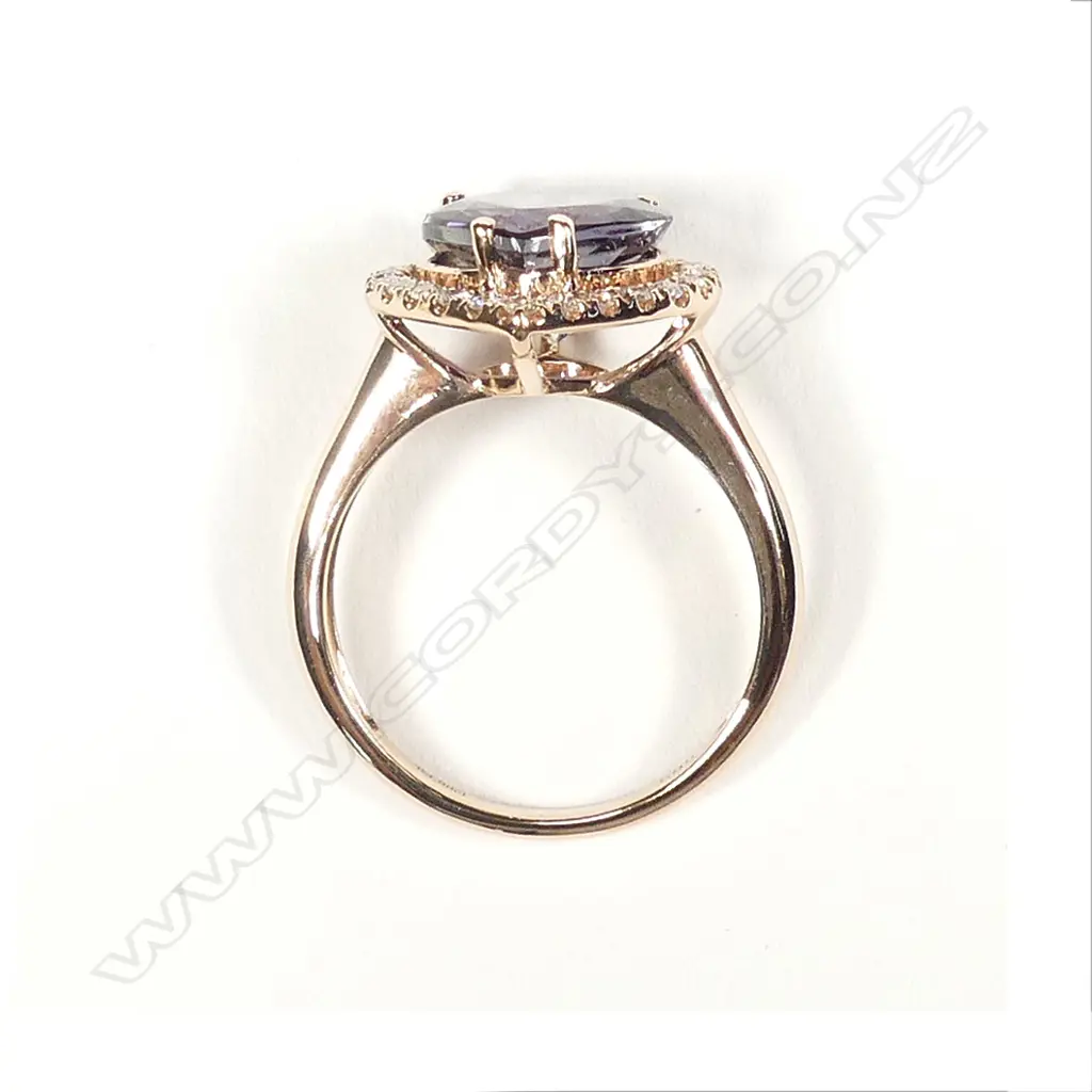 A 14ct rose gold tanzanite and diamond ring Image 1++