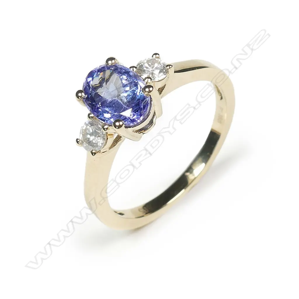 A 14ct gold tanzanite and diamond ring Image 1++