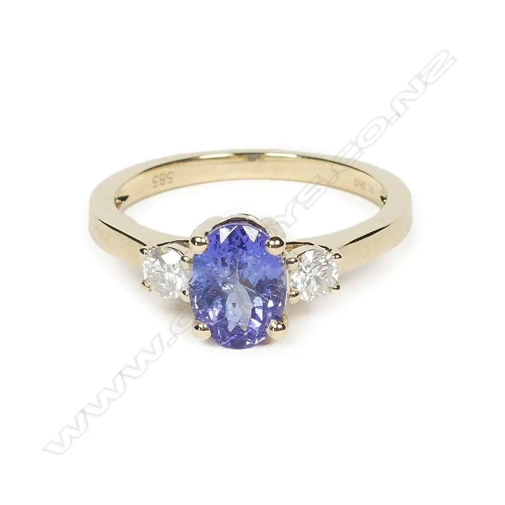 A 14ct gold tanzanite and diamond ring Image 1++