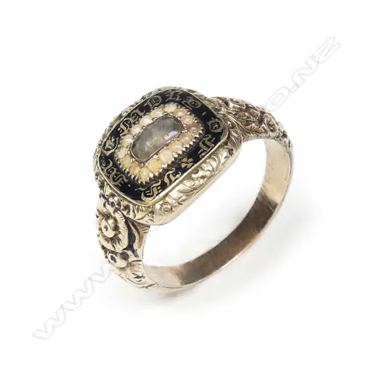 A George III gold enamel and seed pearl mourning ring