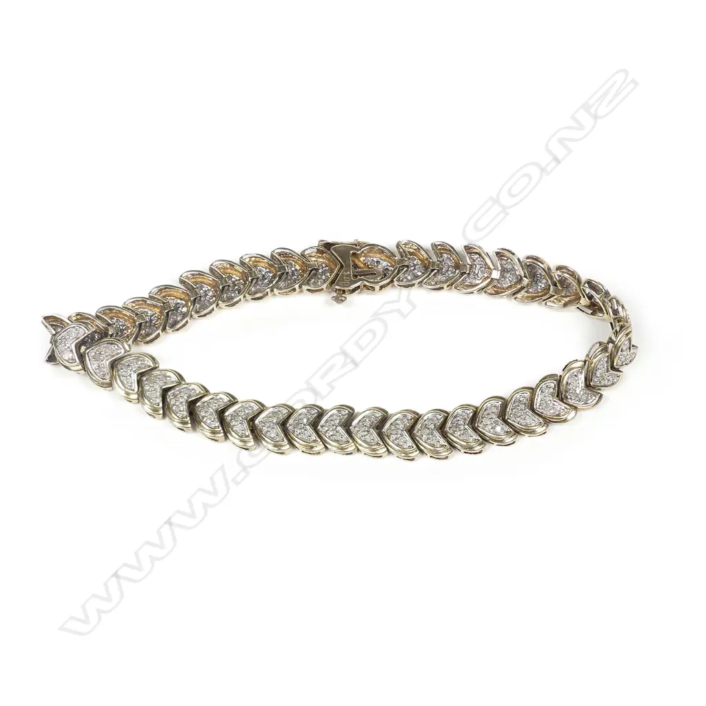 A 9ct yellow gold and multi diamond bracelet Image 1++