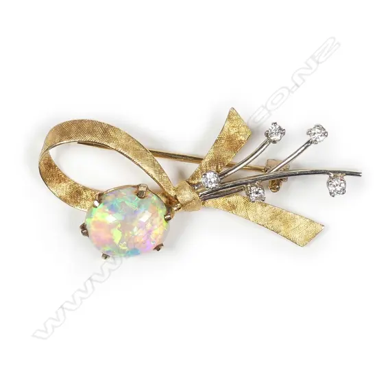 An 18ct opal and diamond set ribbon brooch
