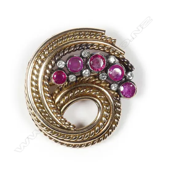 A c.1960 14ct rose gold ruby and diamond set brooch
