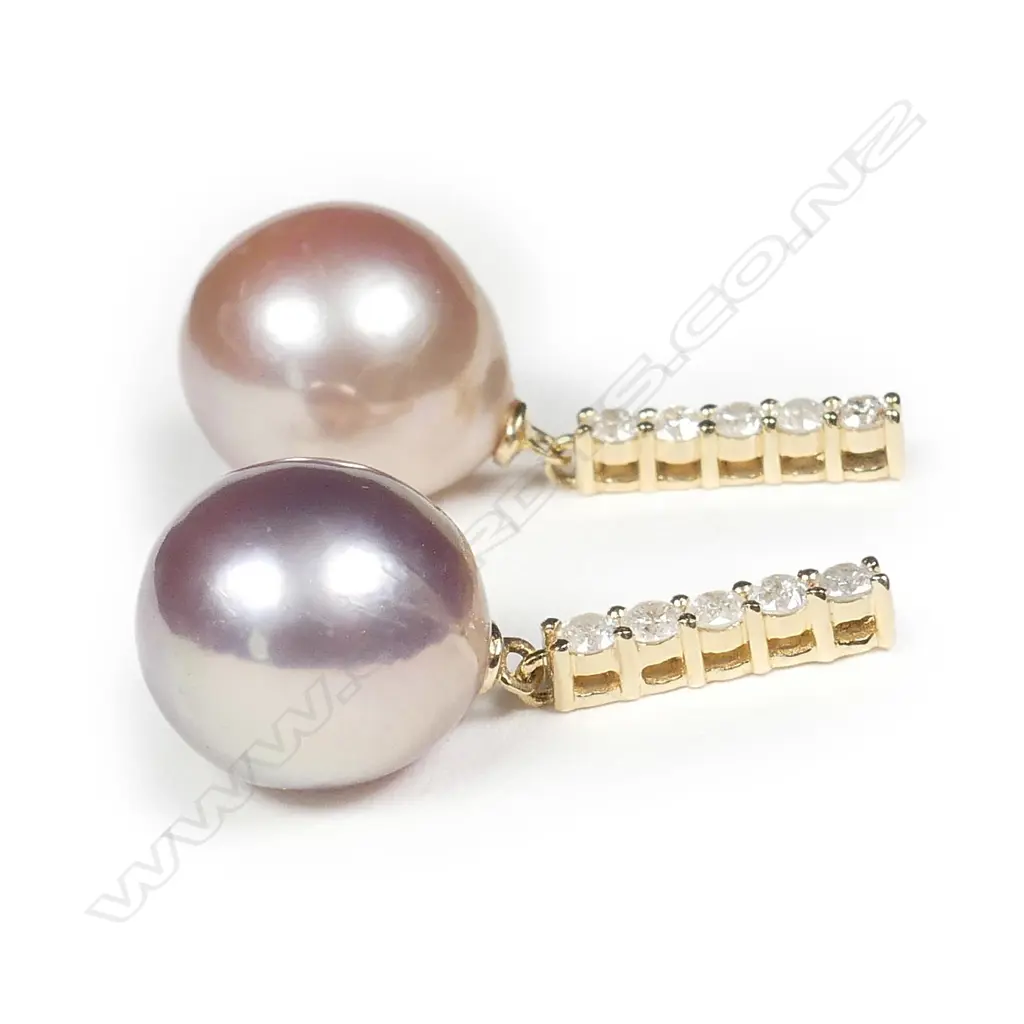 A pair of 14ct gold pearl and diamond drop earrings Image 1++