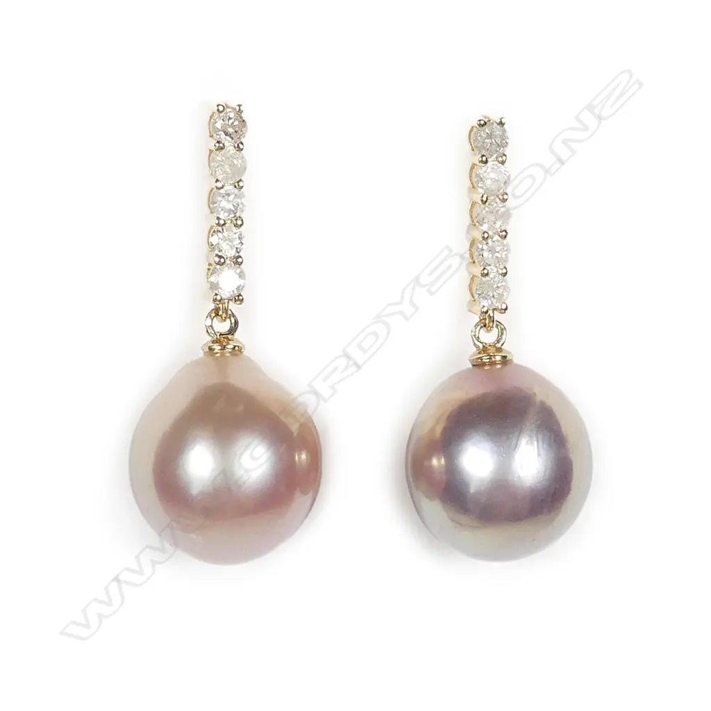 A pair of 14ct gold pearl and diamond drop earrings Image 1++
