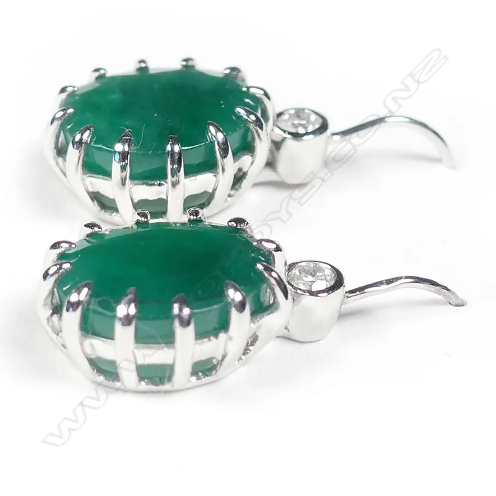 A pair of 14ct white gold emerald and diamond earrings Image 1++