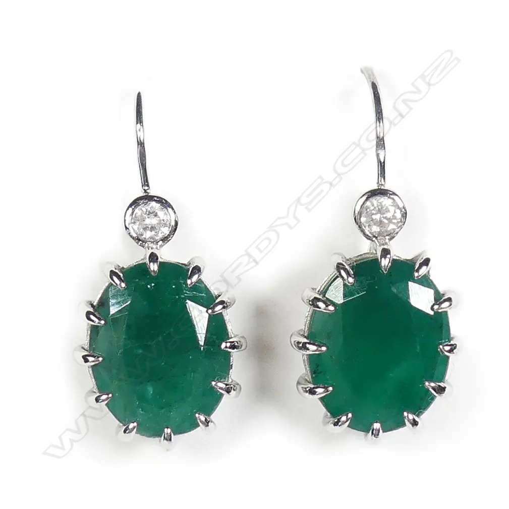A pair of 14ct white gold emerald and diamond earrings Image 1++