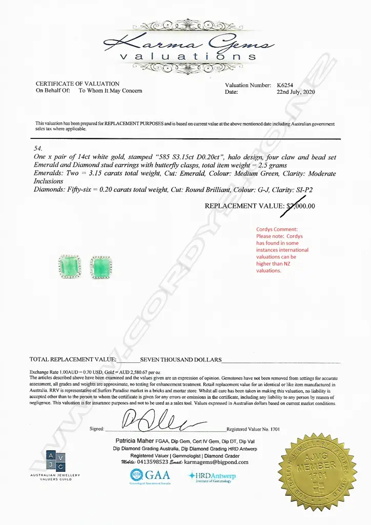 A pair of 14ct white gold emerald and diamond halo stud earrings Image 1++