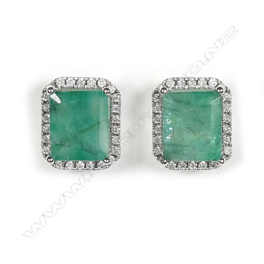 A pair of 14ct white gold emerald and diamond halo stud earrings Image 1++