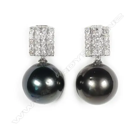 A pair of 14ct white gold pearl and diamond earrings