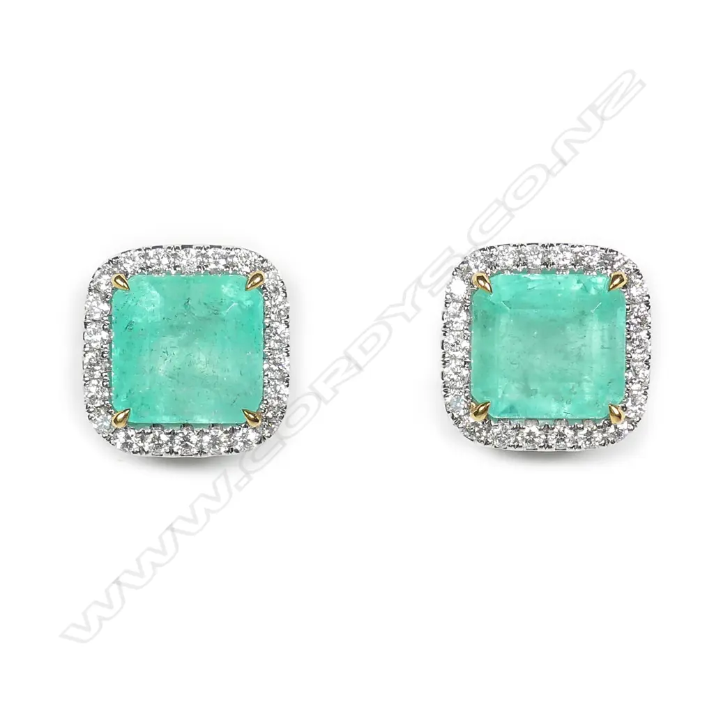 A stylish pair of platinum emerald and diamond stud earrings Image 1++