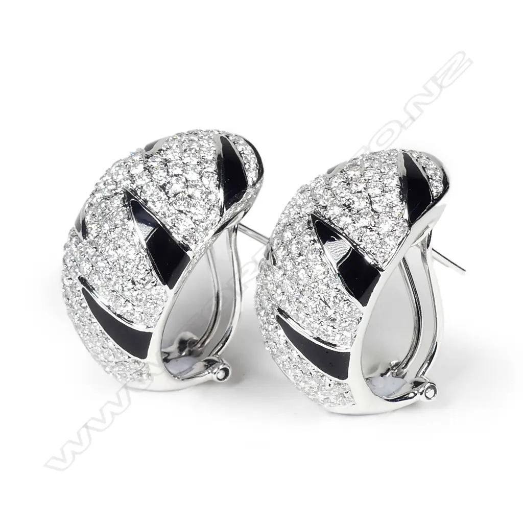 A pair of modern 18ct. white gold diamond and black enamel striking earrings Image 1++