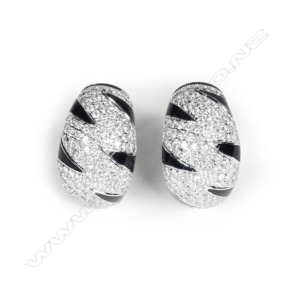 A pair of modern 18ct. white gold diamond and black enamel striking earrings Image 1++