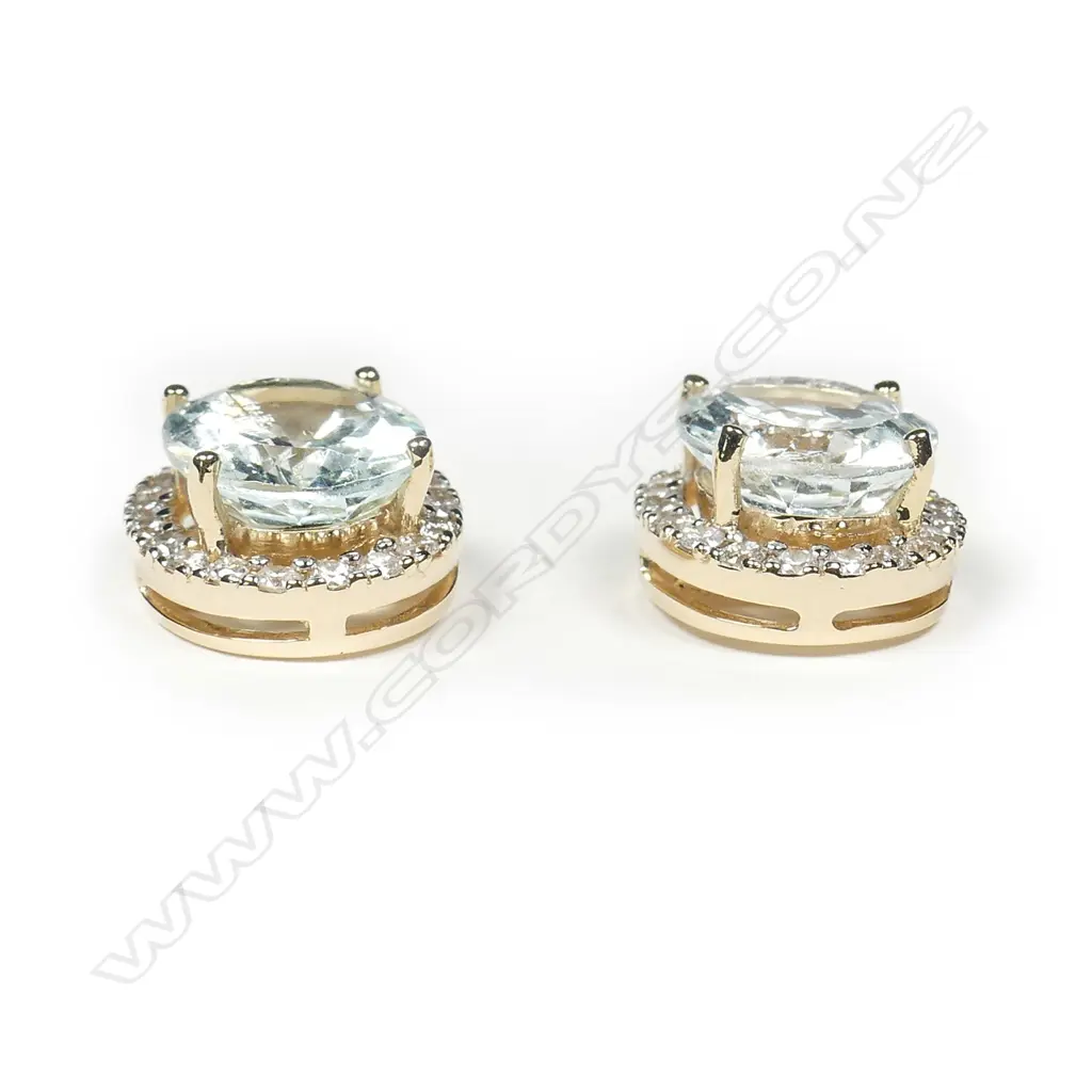 A pair of 14ct gold aquamarine and diamond halo earrings Image 1++