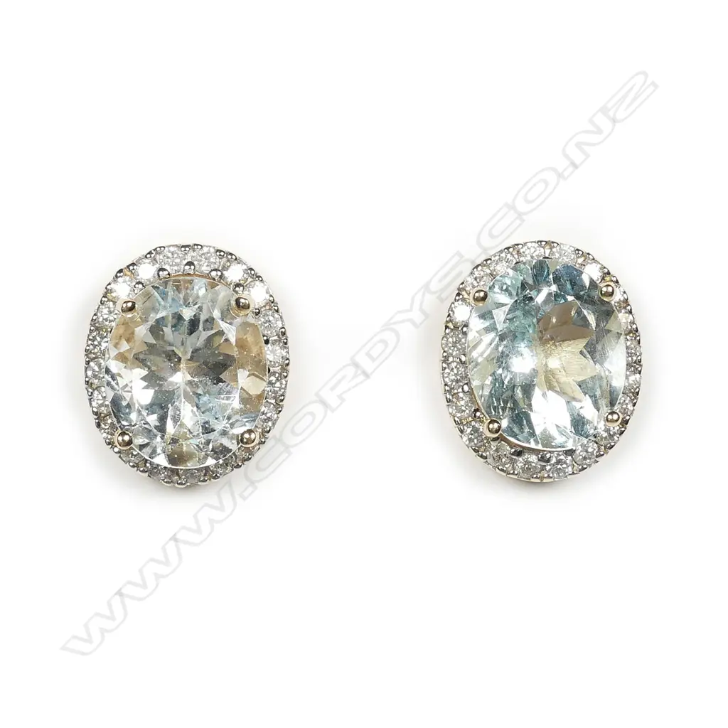 A pair of 14ct gold aquamarine and diamond halo earrings Image 1++