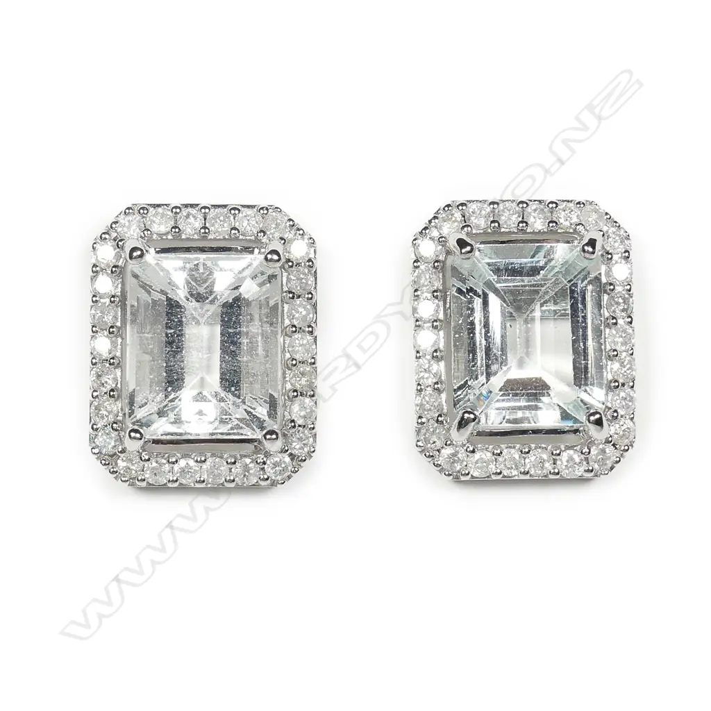 A pair of 14ct white gold aquamarine and diamond stud earrings Image 1++