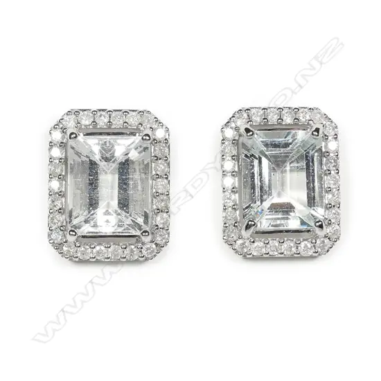 A pair of 14ct white gold aquamarine and diamond stud earrings