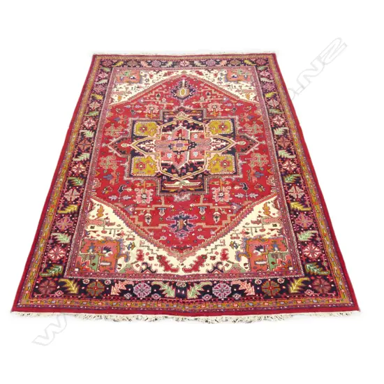 A very large Persian Heriz hand knotted carpet