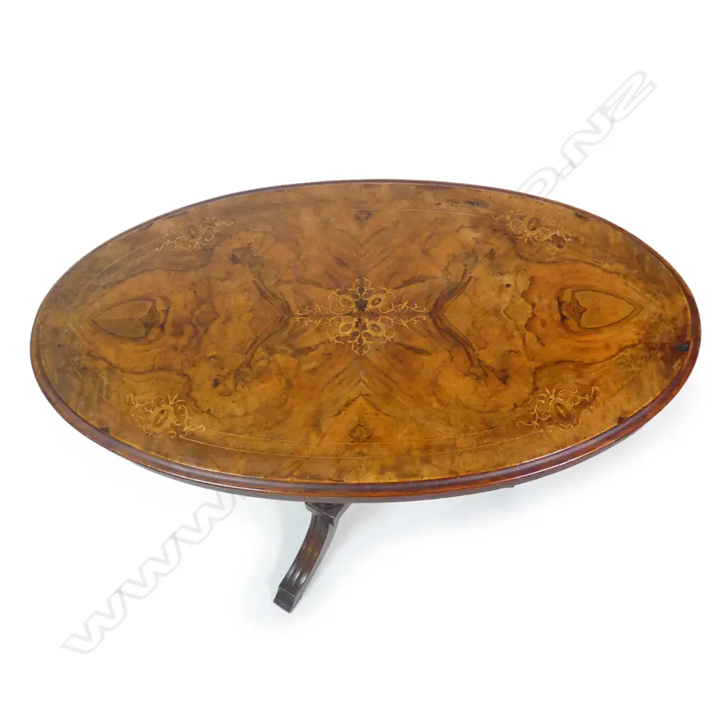 A Victorian walnut occasional table Image 1++