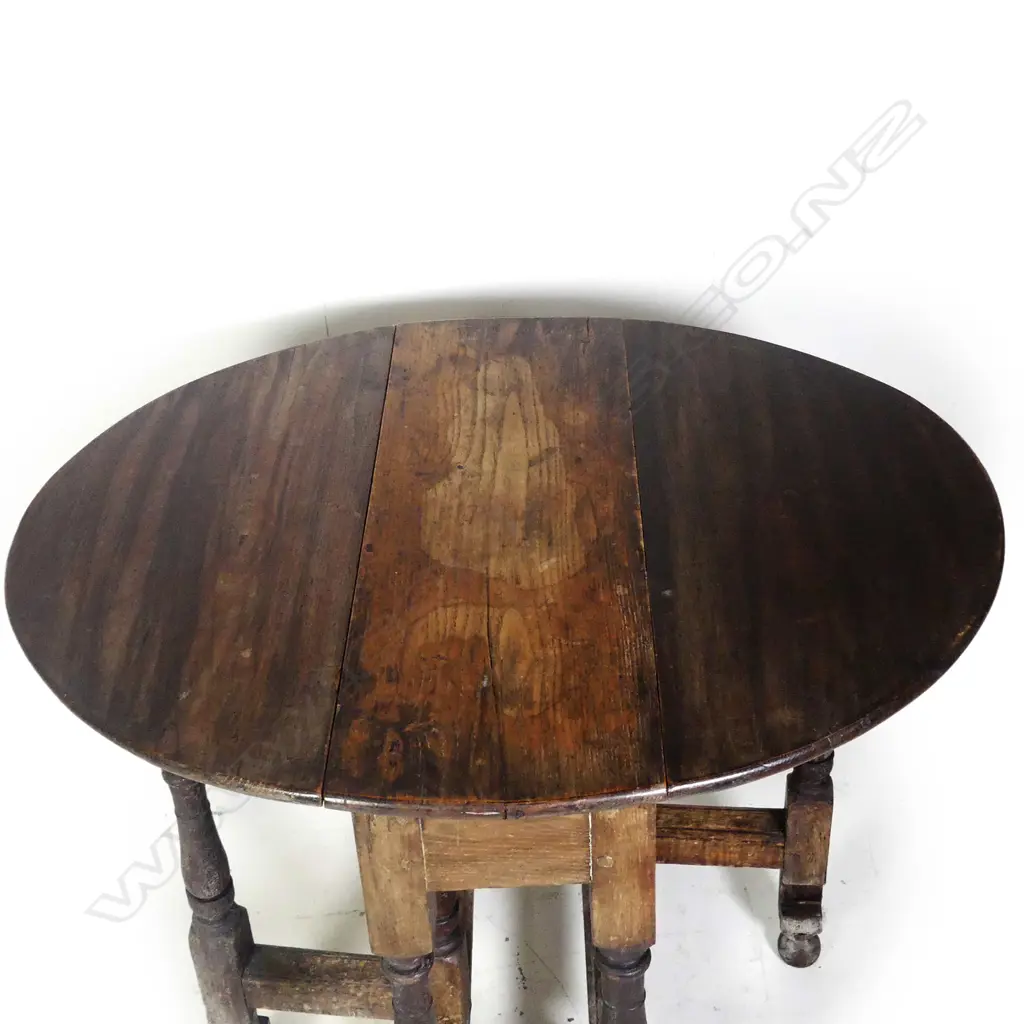 A George III country oak gateleg dining table Image 1++