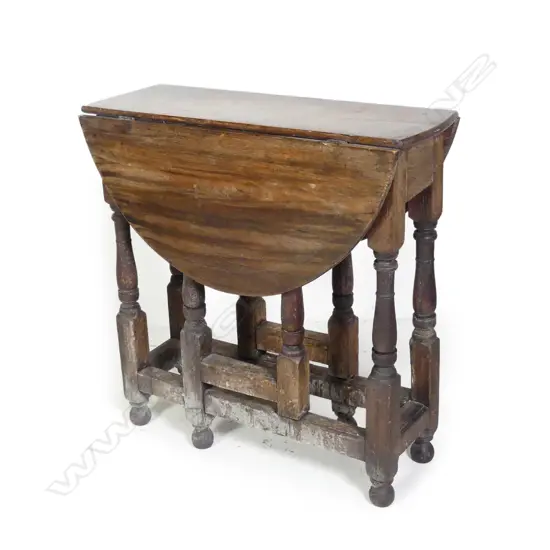 A George III country oak gateleg dining table