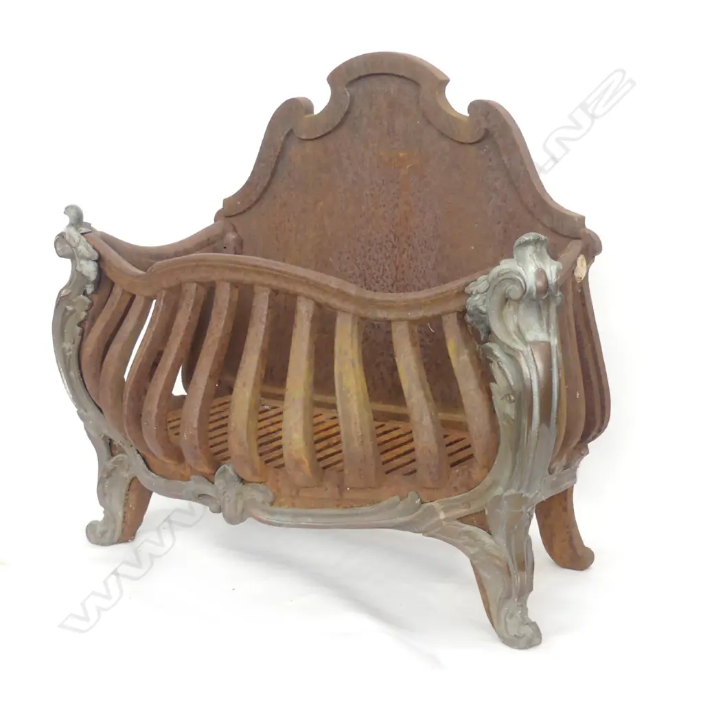 An old cast iron fire grate Image 1++