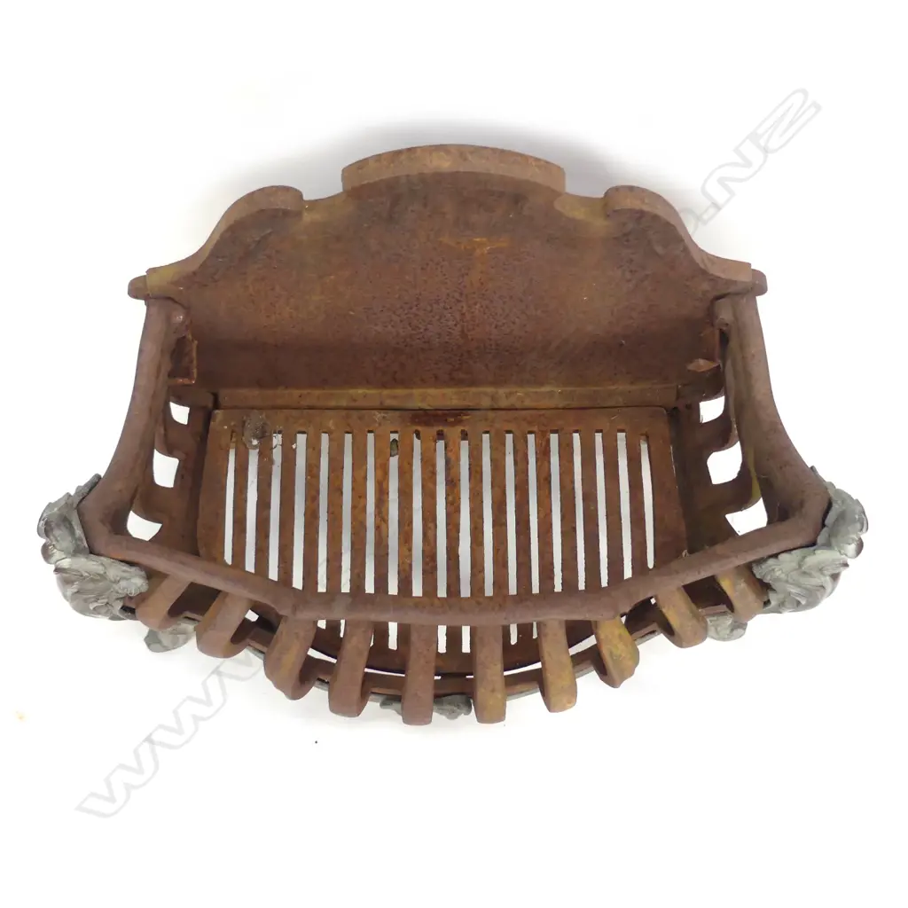 An old cast iron fire grate Image 1++