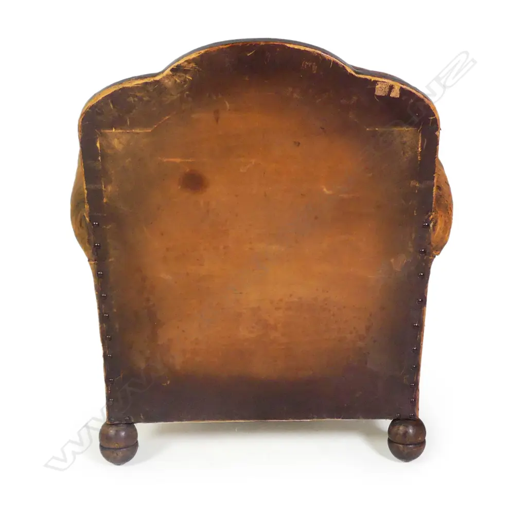 A vintage leather club chair Image 1++