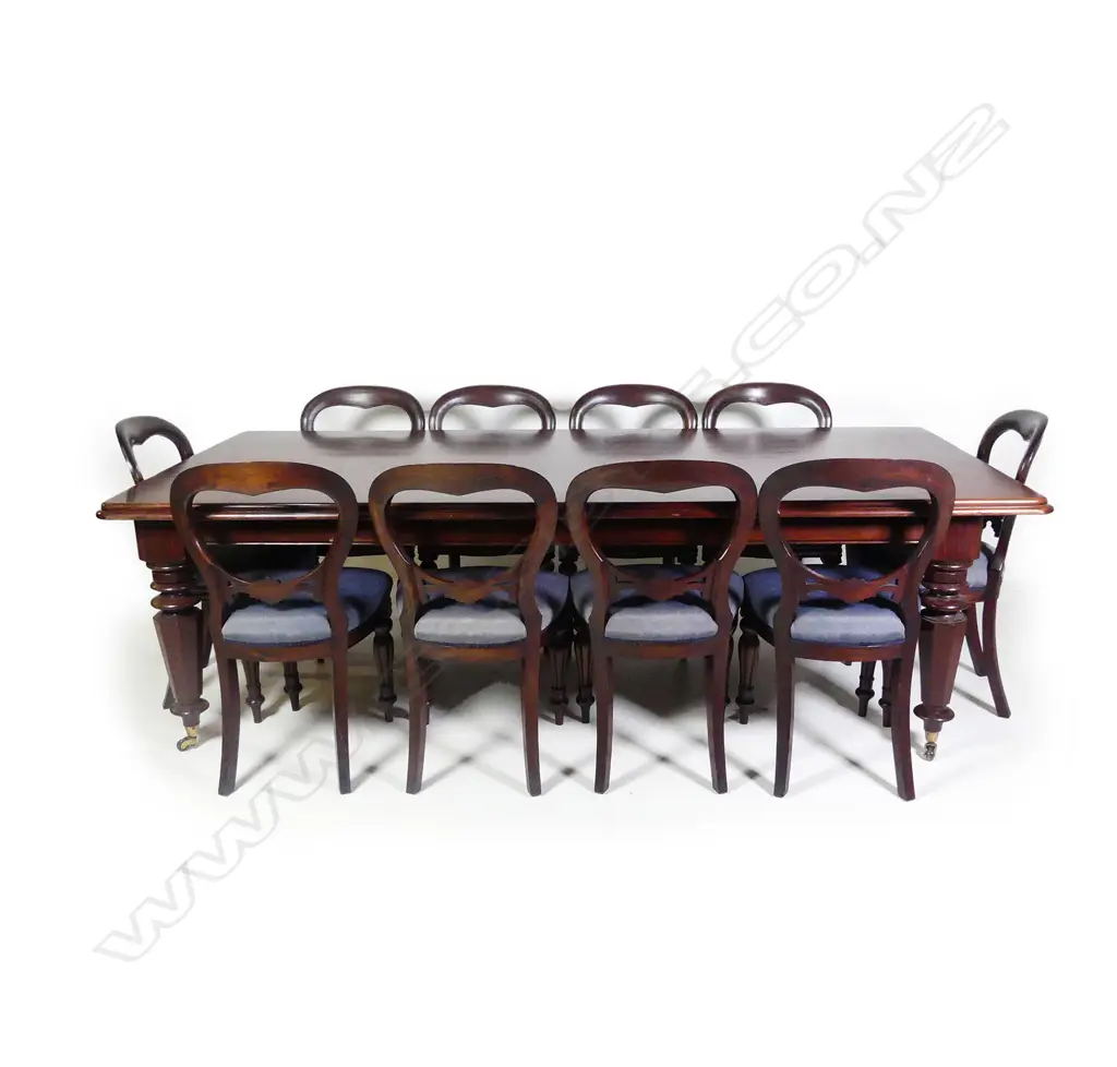 A Victorian style mahogany banquet dining table and ten balloon back dining chairs Image 1++