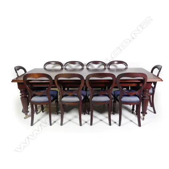 A Victorian style mahogany banquet dining table and ten balloon back dining chairs