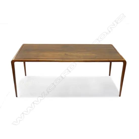 A mid-century teak dining table