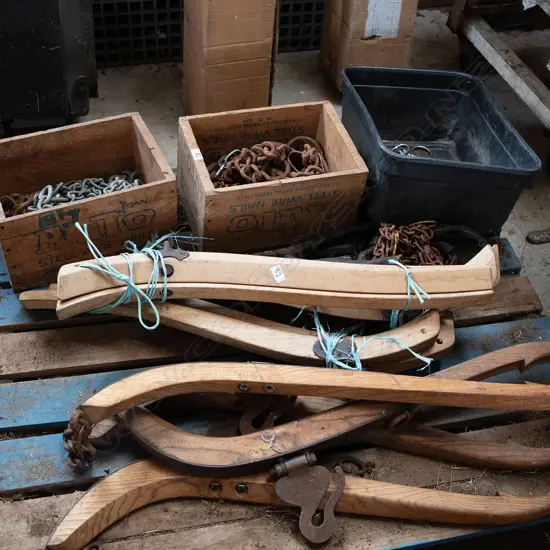 Four boxes of Plough chains and ten wooden Hames,